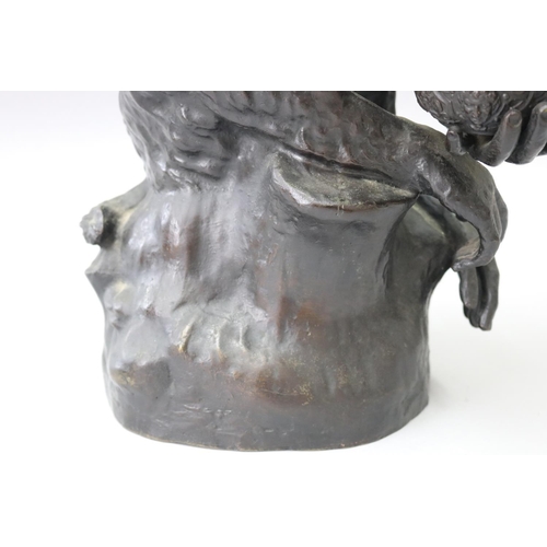 22 - Large cast bronze of a seated monkey holding a bowl and pipe, signed to back Panigatti, approx 43cm ... 