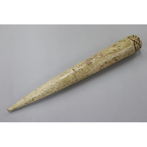 230 - Antique 19th century whale bone fid, carved spliced rope decoration to the top, approx 26 cm L