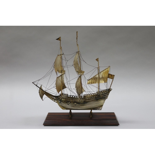 252 - Silver plate three mast ship, on dolphin supports attached to wooden base, approx 31cm H x 29cm W