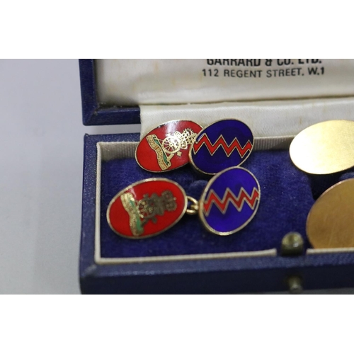 257 - Two pairs of the Royal Artillery Regoment cufflinks, one 9ct gold