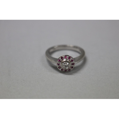 294 - Pink sapphire and diamond ring set in white 18ct gold, with valuation