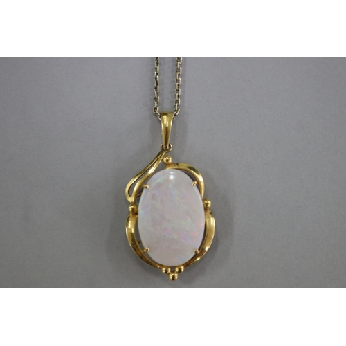 301 - 22ct gold and milk opal pendant on a 9ct gold chain