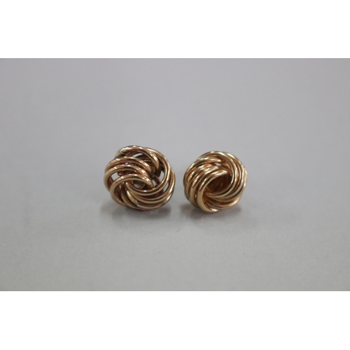 303 - Pair of 9ct gold knot earrings