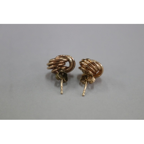 303 - Pair of 9ct gold knot earrings