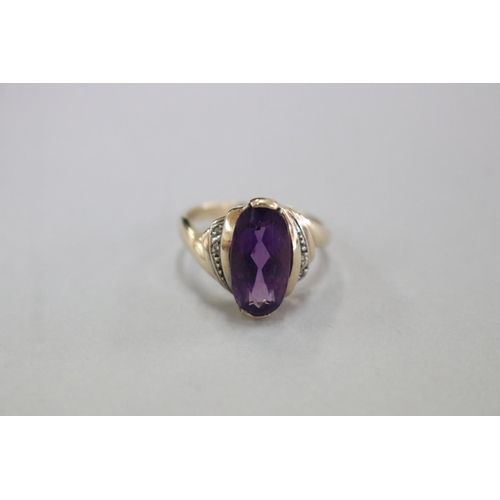 306 - 9ct gold and amethyst ring with small diamonds