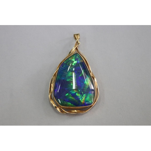 310 - SHOULD READ - 18ct black opal triplet pendant, opal approx 3.5cm L