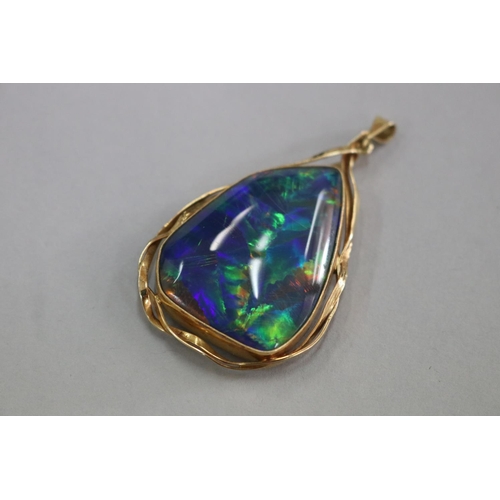 310 - SHOULD READ - 18ct black opal triplet pendant, opal approx 3.5cm L