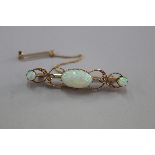 314 - Antique rose gold and milky cabochon opal and diamond bar brooch and safety chain, hallmarked Birmin... 