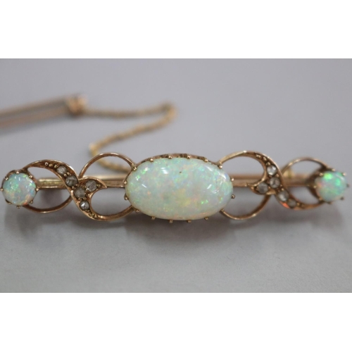 314 - Antique rose gold and milky cabochon opal and diamond bar brooch and safety chain, hallmarked Birmin... 