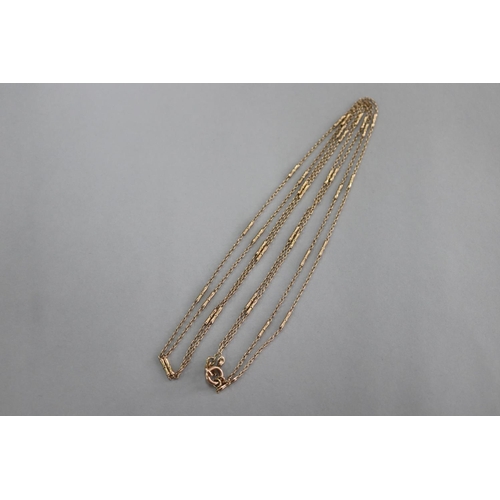 321 - Pair of fine gold chains, marked but unclear, approx 69cm long each (2)