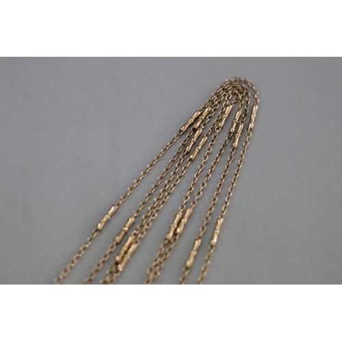 321 - Pair of fine gold chains, marked but unclear, approx 69cm long each (2)