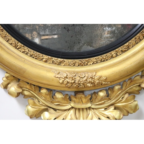 49 - Fine antique Regency giltwood convex circular mirror applied scrolling foliage and crest mounted wit... 