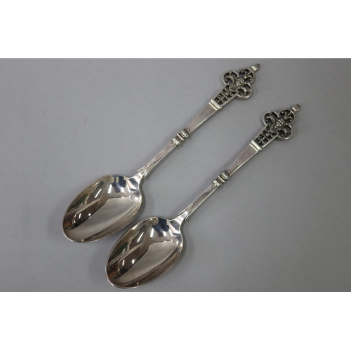 50 - Fine pair of French sterling silver Renaissance revival spoons, pierced terminals, approx 210 grams ... 