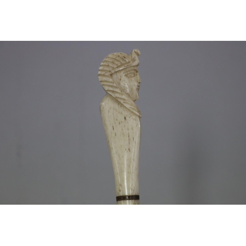70 - Carved bone - Egyptian head handle fly-whisk, approx 18cm L