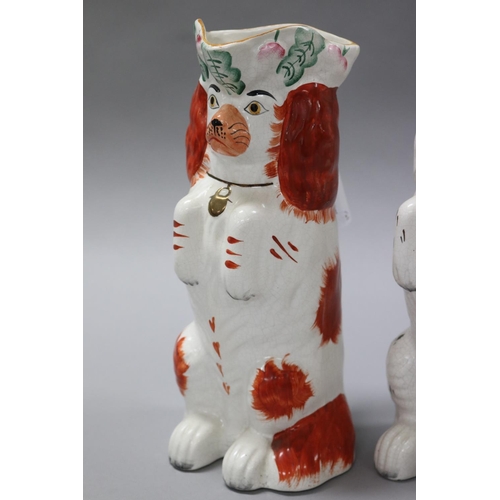 88 - Two Staffordshire begging dog jugs along with a white Staffordshire figure of a dog, approx 26cm H a... 