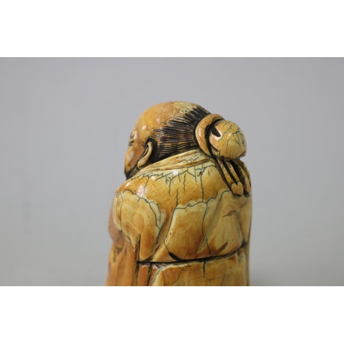 9 - Chinese carved mammoth ivory figure of a god, signed to base, approx 9cm H x 5cm W x 5.5cm D