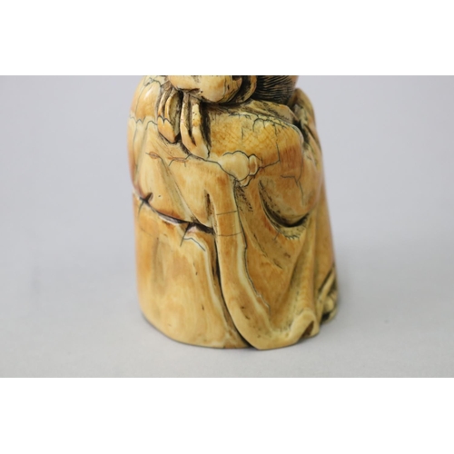 9 - Chinese carved mammoth ivory figure of a god, signed to base, approx 9cm H x 5cm W x 5.5cm D
