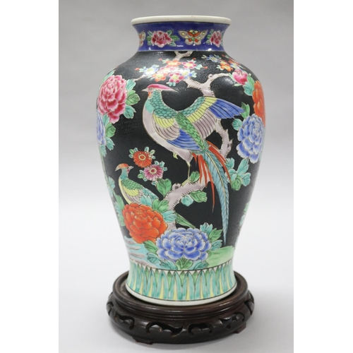 93 - Chinese famille noire vase and wooden stand, approx 34cm H