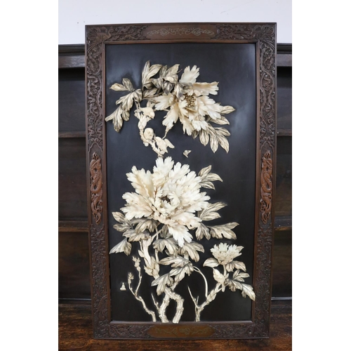104 - Rare antique Meiji period Japanese ebonized panel with carved ivory in high relief of peonies, butte...