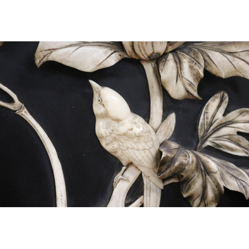 104 - Rare antique Meiji period Japanese ebonized panel with carved ivory in high relief of peonies, butte... 