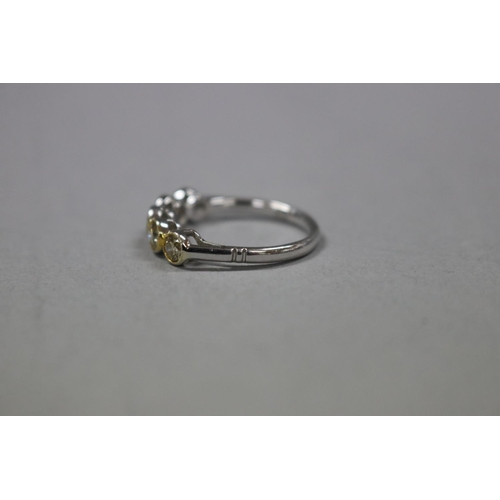 295 - Five stone yellow diamond ring set in 18ct white and yellow gold, with valuation