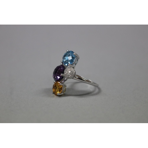 296 - Diamond, Blue topaz, citrine and amethyst cocktail ring set in 18ct white gold, as per valuation