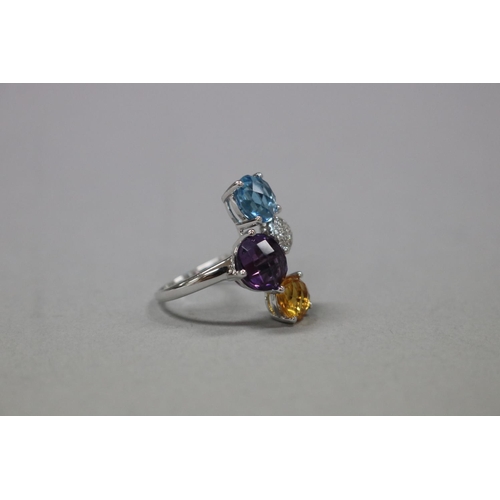 296 - Diamond, Blue topaz, citrine and amethyst cocktail ring set in 18ct white gold, as per valuation