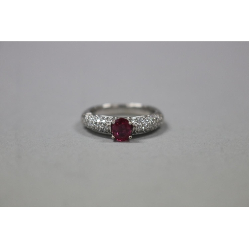 299 - Diamond and ruby dress ring set in white gold, as per valuation