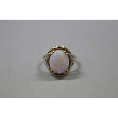319 - 9ct gold and diamond, milky opal ring