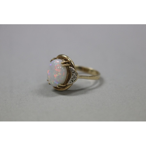 319 - 9ct gold and diamond, milky opal ring