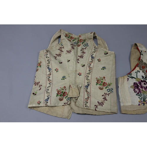 9 - Two antique very early traditional vest - one with fabric and silver lace to the back and the other ... 