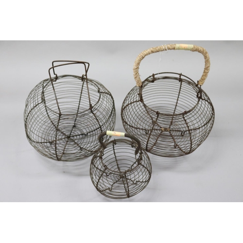 20 - Three old French wire work egg baskets, approx 31cm H, 24cm H and 19cm H (3)