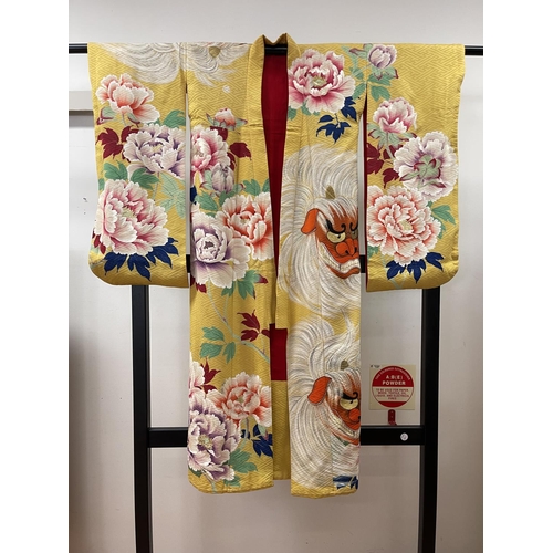 62 - Japanese silk kimono (child's), of yellow ground. old traditional design