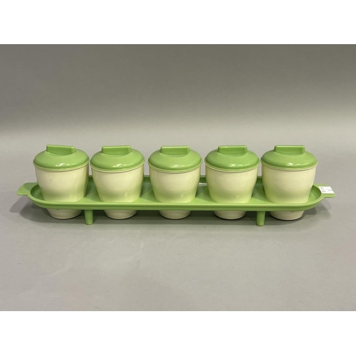 2018 - Brisitolite cream and green Bakelite spice canister set, fitted with five canisters on slotted stand... 