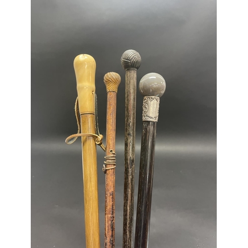 1022 - Four various walking sticks, comprising 1 with ivory handle, an agate and silver mounted stick dated... 