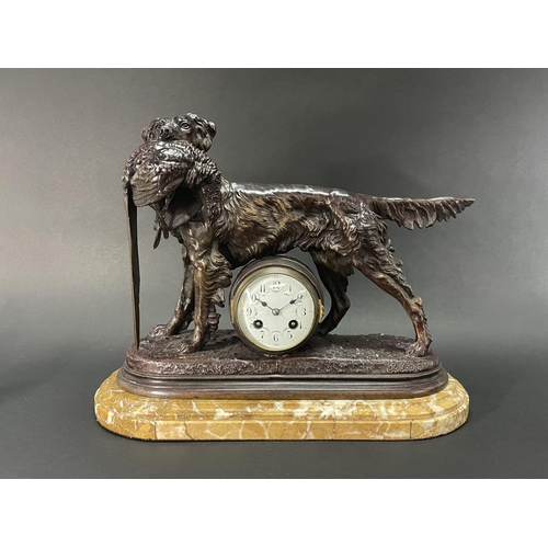 1046 - A patinated spelter mantel clock After Jules Moigniez (French, 1835-1894), late 19th century, has ke... 