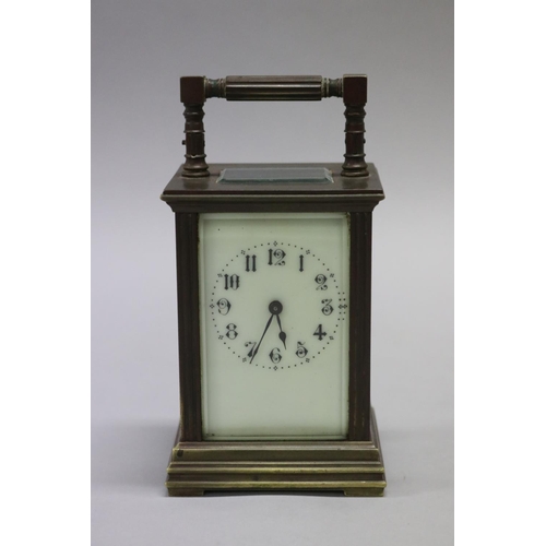 37 - Victorian brass cased carriage clock with faux ivory enamelled dial, the case with moulded uprights ... 