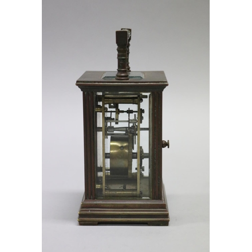 37 - Victorian brass cased carriage clock with faux ivory enamelled dial, the case with moulded uprights ... 