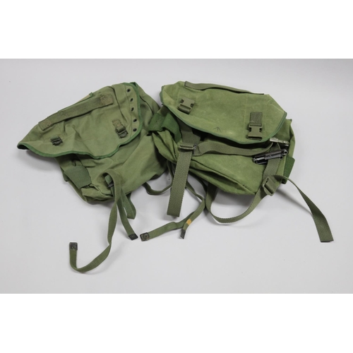 140 - 2 x small back packs with waterproof liners, 1 Australian, 1 USA