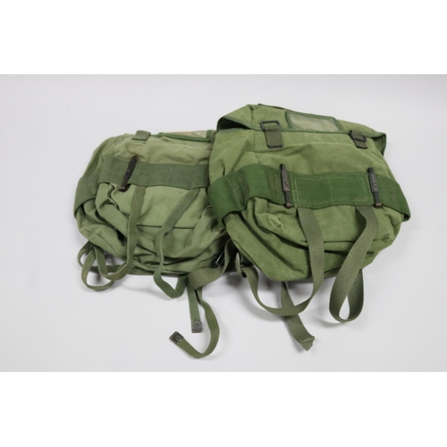 140 - 2 x small back packs with waterproof liners, 1 Australian, 1 USA