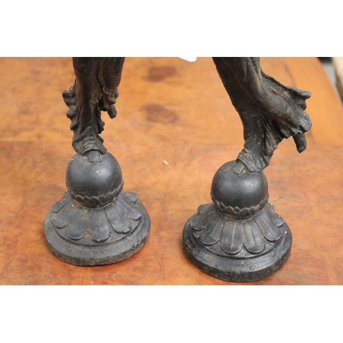 58 - Pair of cast iron figural candlesticks, each approx 41cm H excluding candles (2)