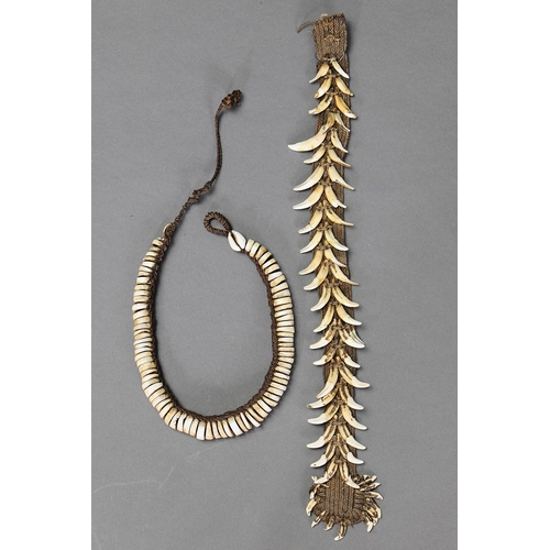 1026 - PAIR OF ORNAMENTS, PAPUA NEW GUINEA. Dog teeth, Shells and natural fibre. Approx Lengths 27cm & 47cm... 