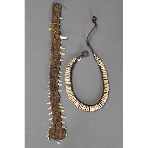 1026 - PAIR OF ORNAMENTS, PAPUA NEW GUINEA. Dog teeth, Shells and natural fibre. Approx Lengths 27cm & 47cm... 