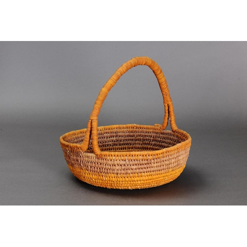 1097 - COILED PANDANUS BASKET, NORTHERN TERRITORY. Woven plant fibre. The basket is made from fibre using a... 