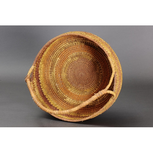 1098 - LARGE COILED PANDANUS BASKET, NORTHERN TERRITORY. Woven plant fibre. The basket is made from fibre u... 