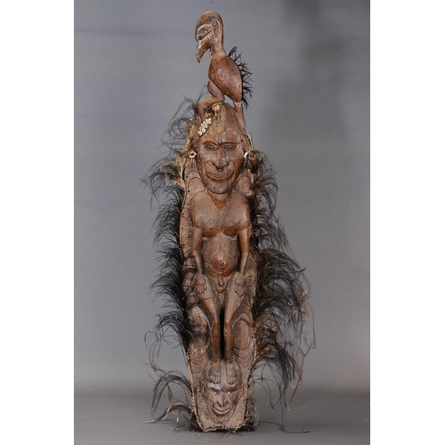 1114 - LARGE SEPIK FIGURE, PAPUA NEW GUINEA. Carved and engraved hardwood with shells, natural fibre and na... 