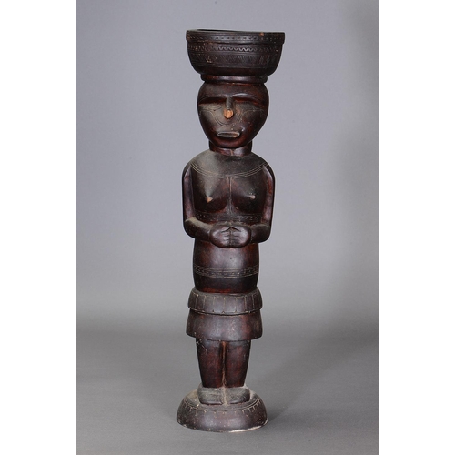 1115 - LARGE MASSIM FIGURE, TROBRIAND ISLANDS, PAPUA NEW GUINEA. Carved and engraved hardwood. Approx L70.5... 