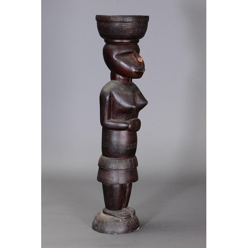 1115 - LARGE MASSIM FIGURE, TROBRIAND ISLANDS, PAPUA NEW GUINEA. Carved and engraved hardwood. Approx L70.5... 