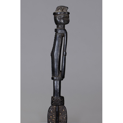 1118 - MASSIM LIME SPATULA, TROBRIAND ISLANDS, PAPUA NEW GUINEA. Carved and engraved hardwood, dark glossy ... 