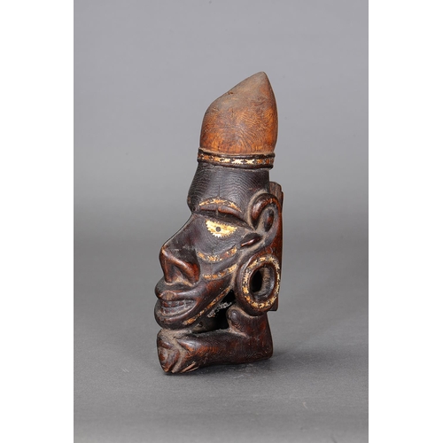 1122 - NGUZU NGUZU CANOE PROW ORNAMENT, SOLOMON ISLANDS. Carved and engraved wood, black dye, nautilus shel... 